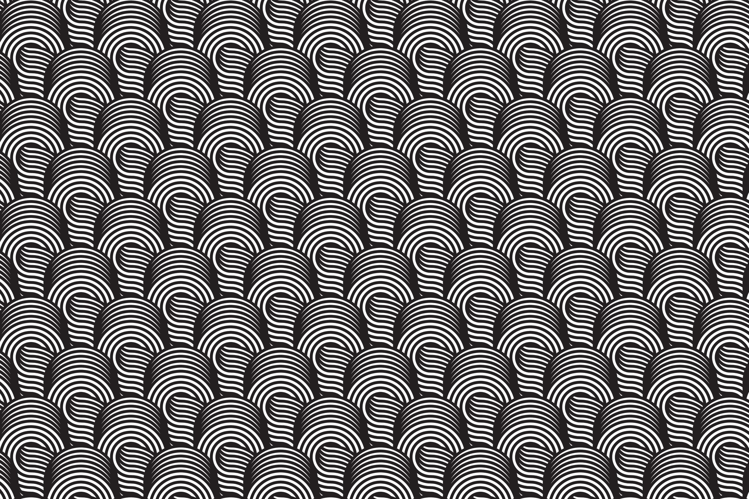 A black and white optical illusion pattern crafted by Millworks Web Design & Graphics consists of numerous curved lines creating a series of arch-like shapes. The design appears to have a wave-like, repetitive structure, producing a visually striking, hypnotic effect.