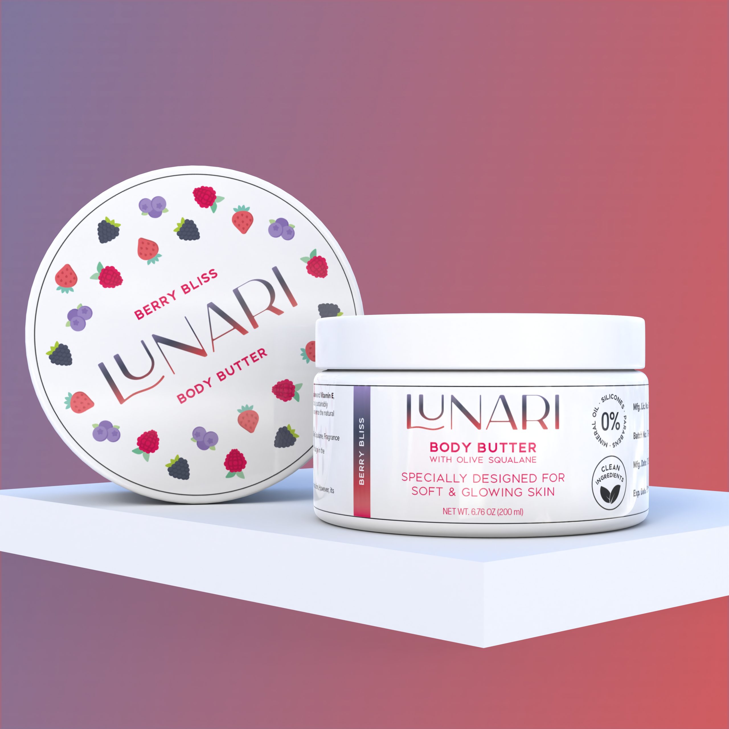 A round container of Lunari Berry Bliss Body Butter sits on a white platform. The lid, adorned with colorful berry illustrations and the Lunari logo, is propped beside the jar, which features product details and a purple and white label.