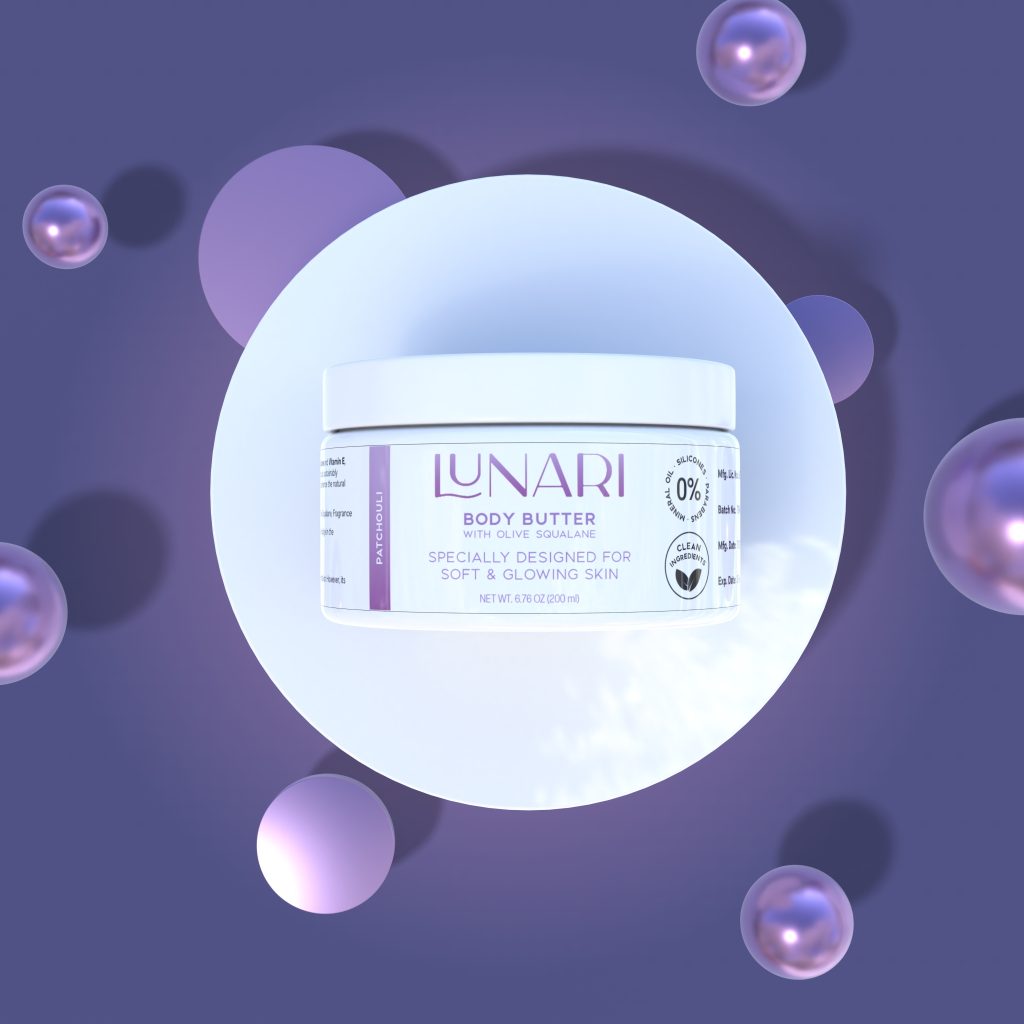 A white jar of Lunari Body Butter with lilac labeling sits on a circular white platform, surrounded by soft purple spheres and a lavender background. The Lunari label highlights its use for soft, glowing skin.
